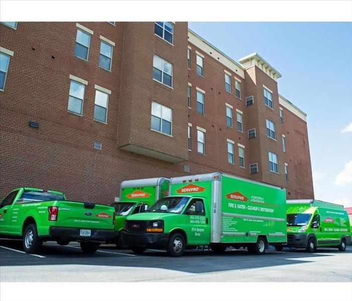 SERVPRO trucks in front of building
